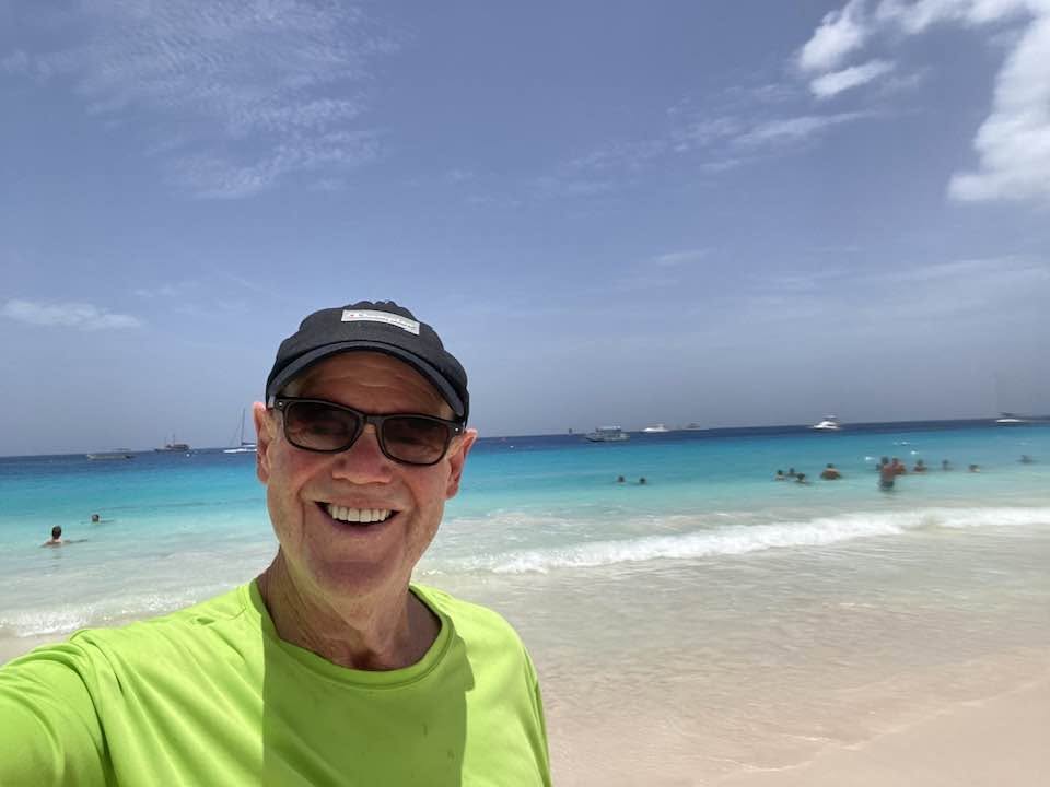 John Chapman on a beach in Barbados
